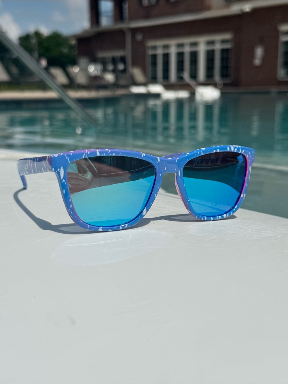 Sunglasses on pool deck